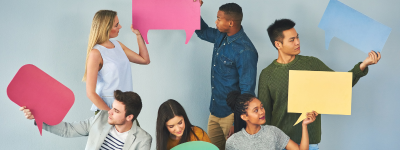 Teenagers holding speech bubbles